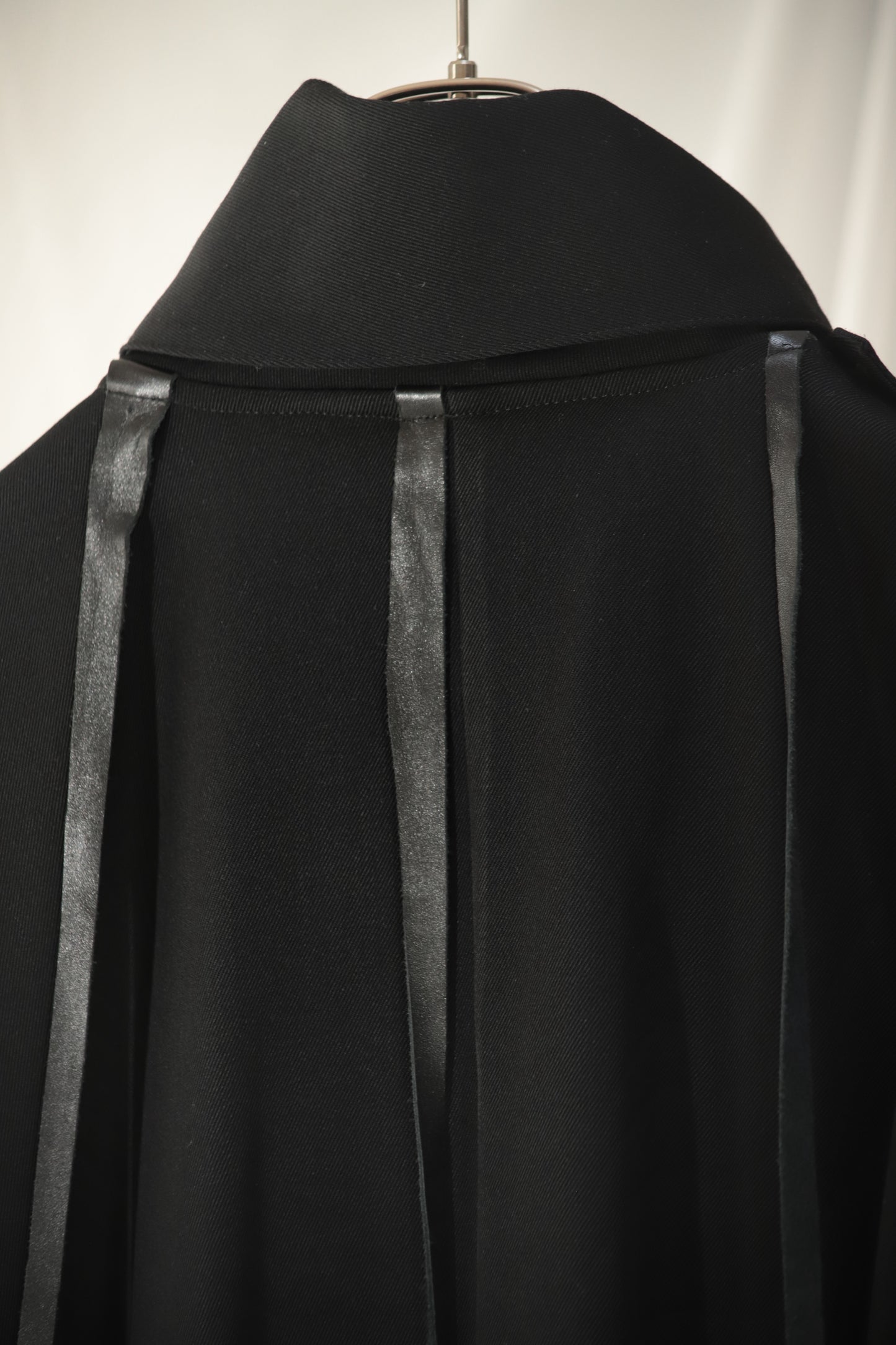 wool × leather layered coat