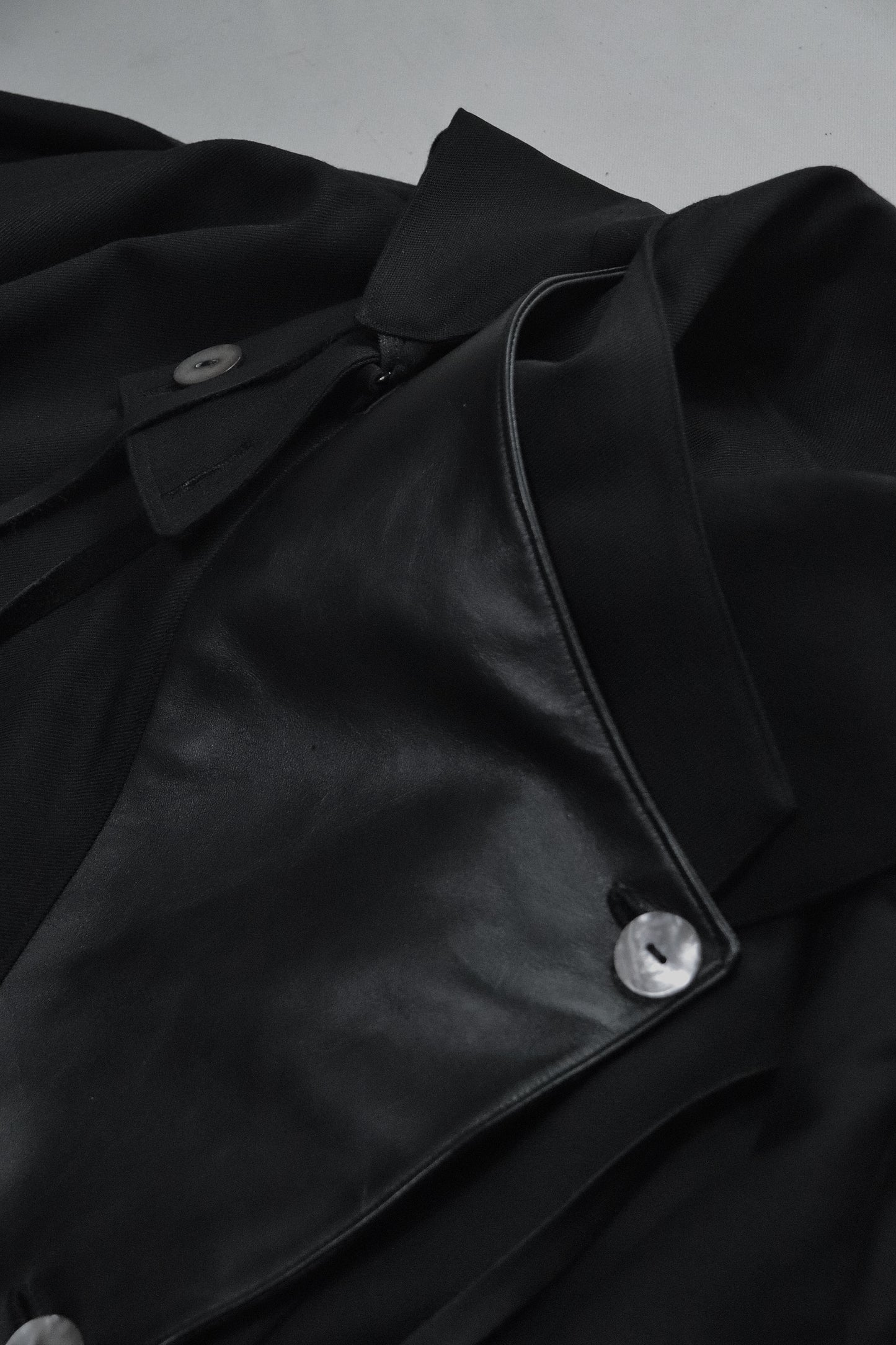 wool × leather layered coat