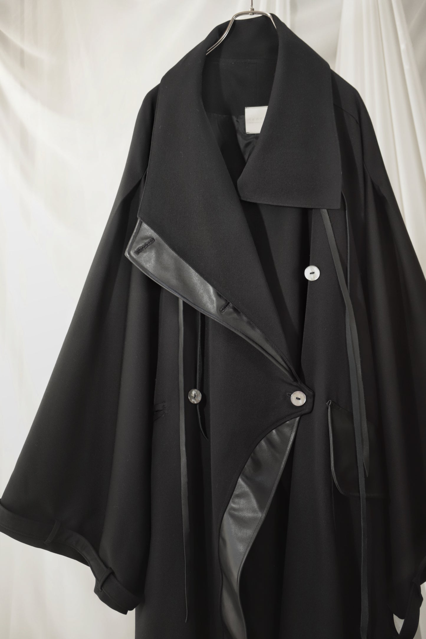 wool × leather layered coat