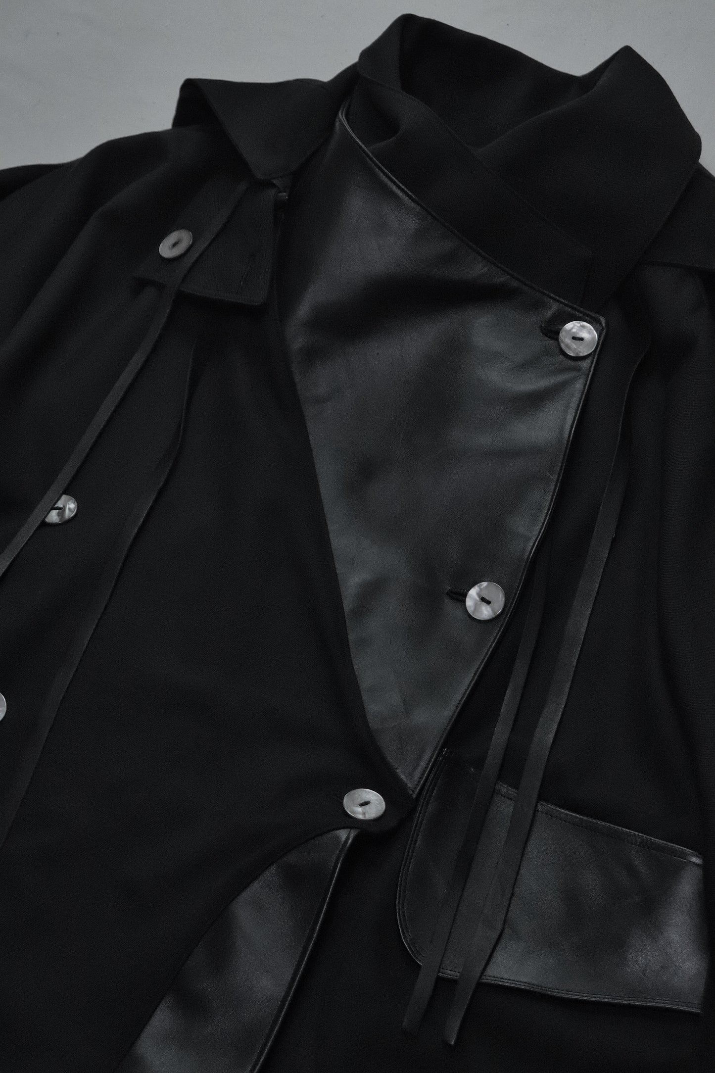 wool × leather layered coat