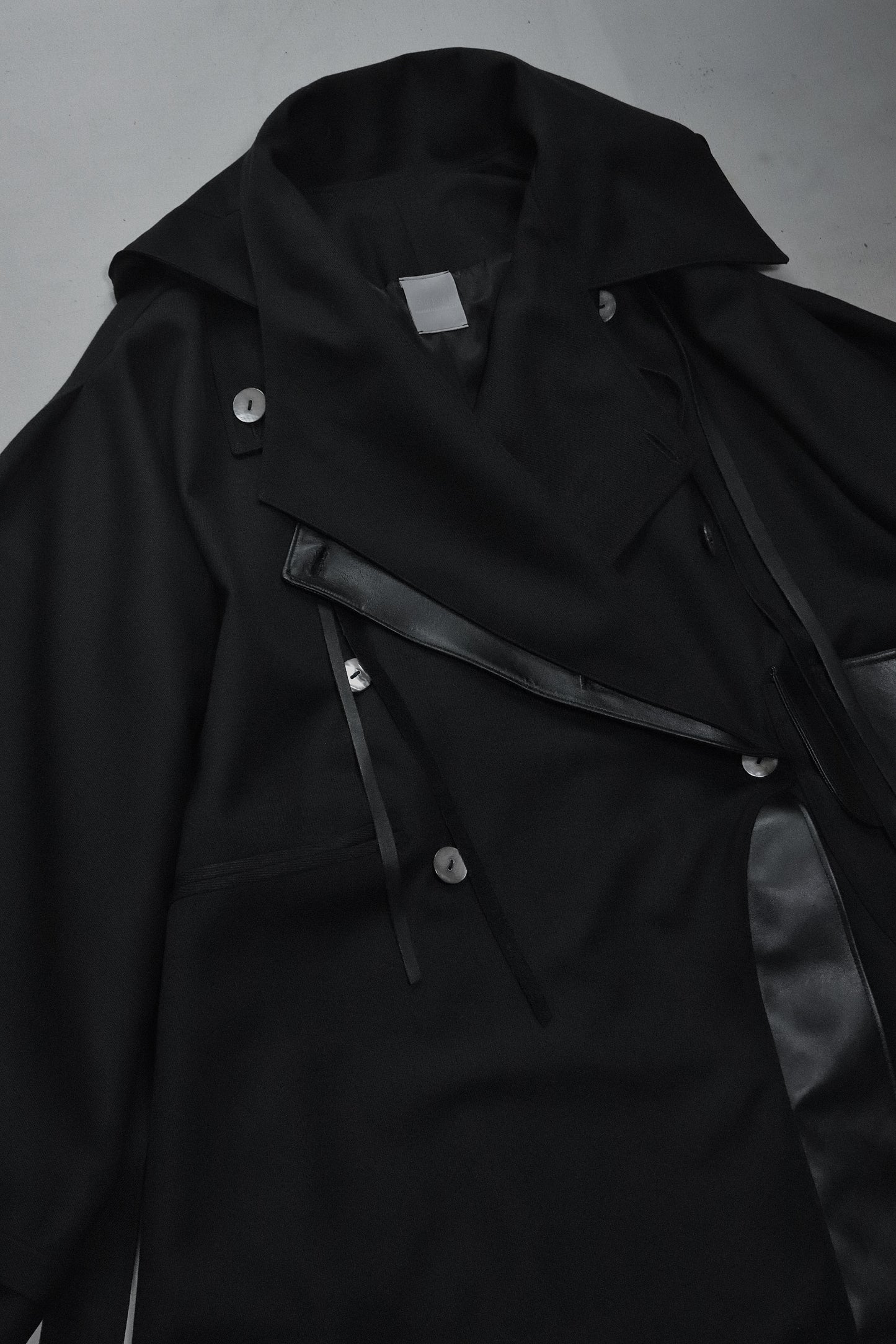 wool × leather layered coat