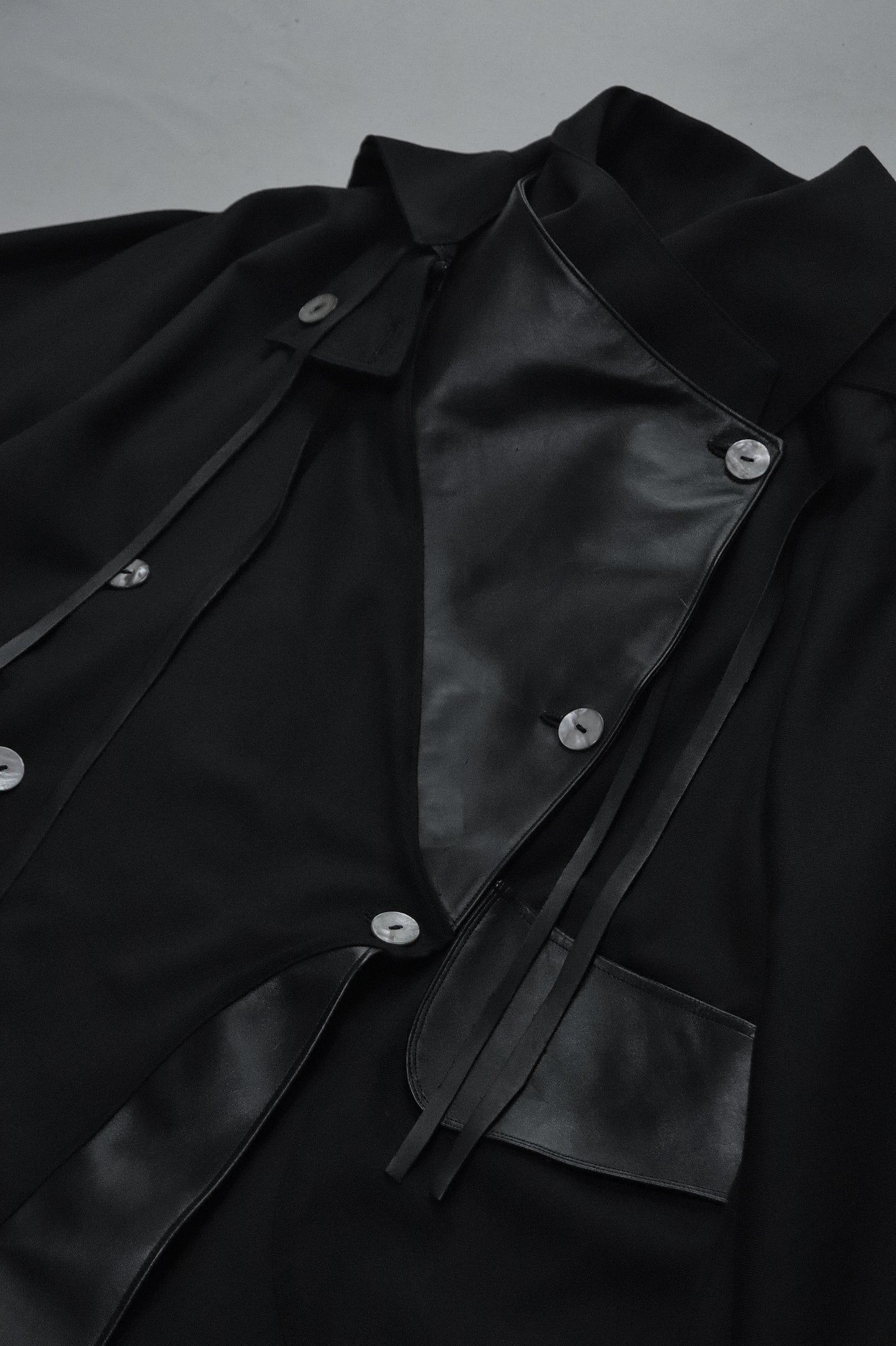 wool × leather layered coat