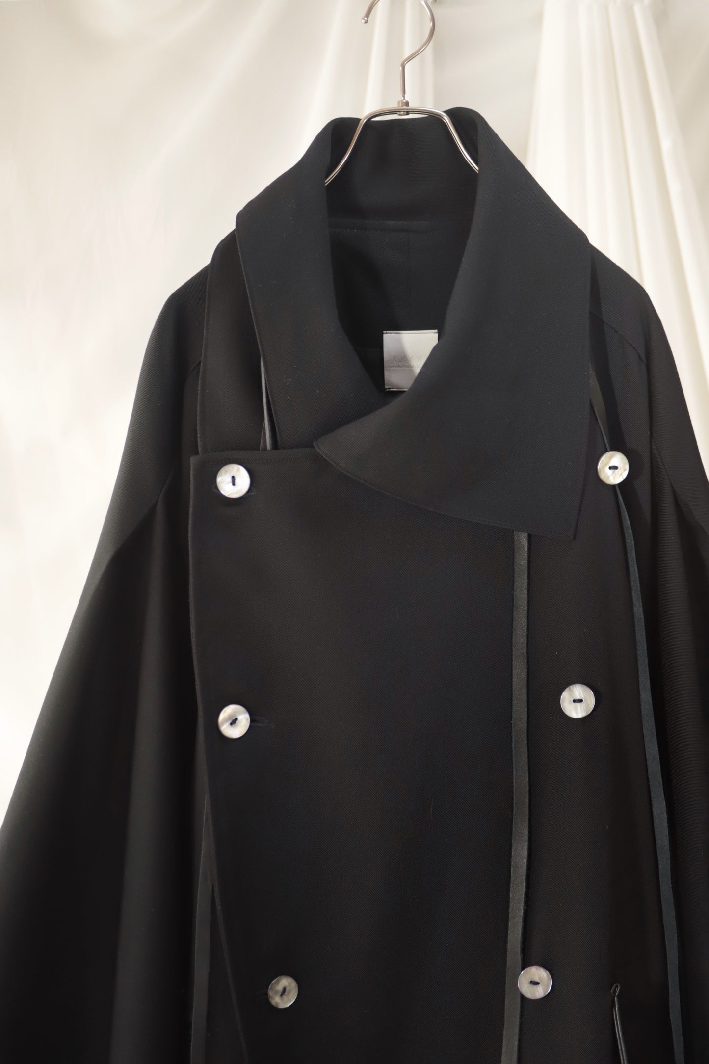 wool × leather layered coat