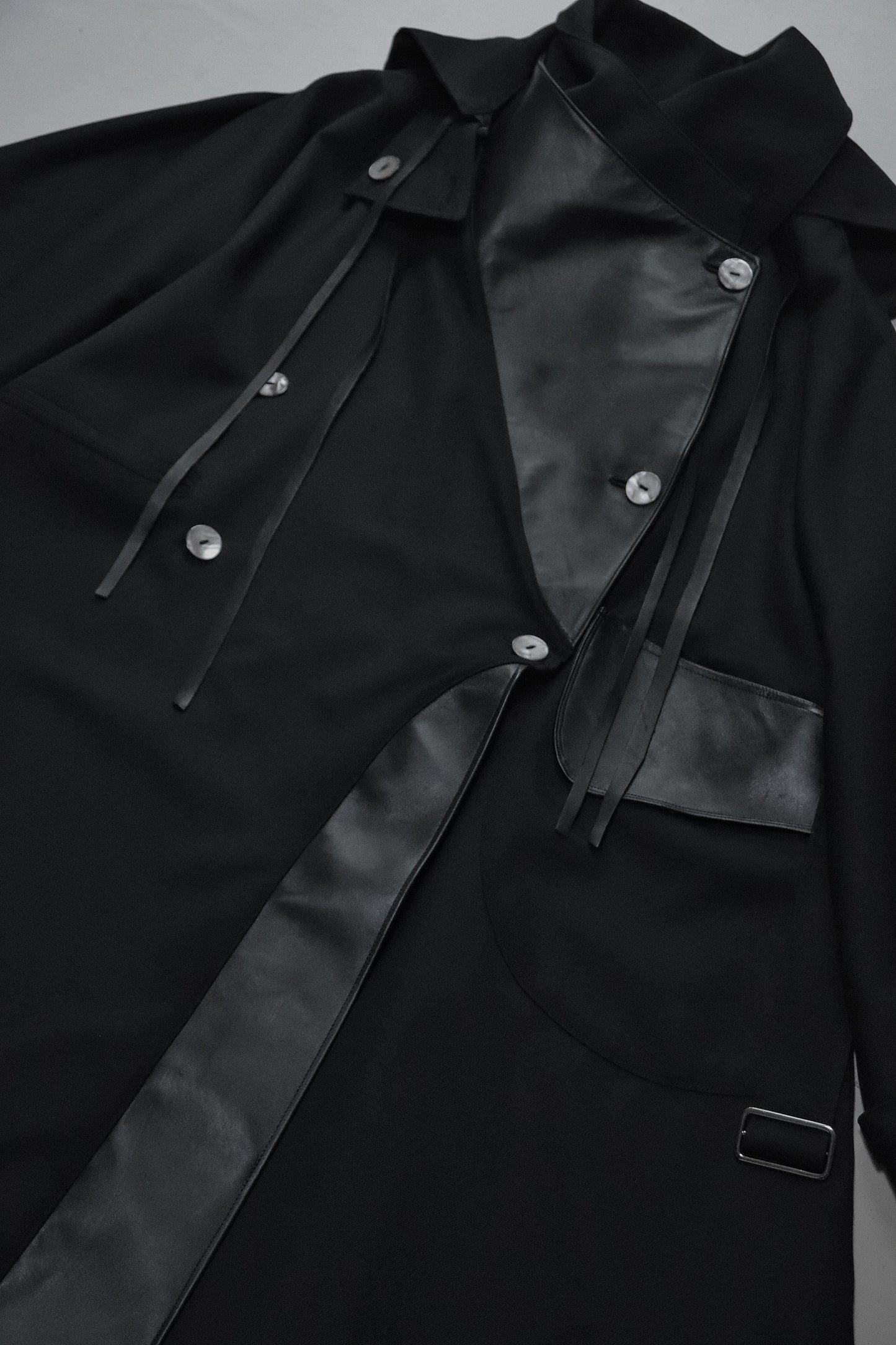 wool × leather layered coat